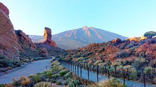 Scenic view of mountain against blue sky