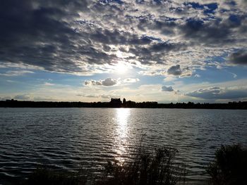 Scenic view of lake against sky during sunset