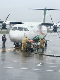 People at airport runway