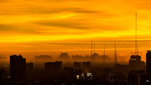 Cityscape against sky during sunset