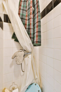 Midsection of man standing in bathroom