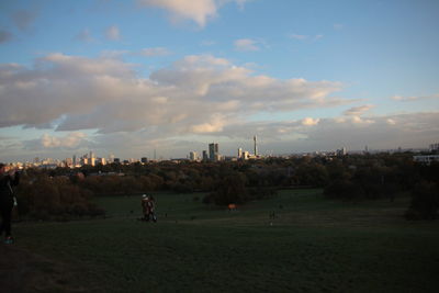 People in city against sky