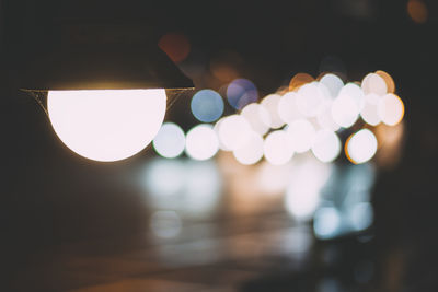 Defocused image of illuminated lights at night