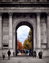 People in front of built structure