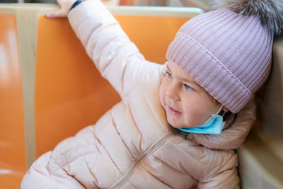 Cute young girl on the train in nyc