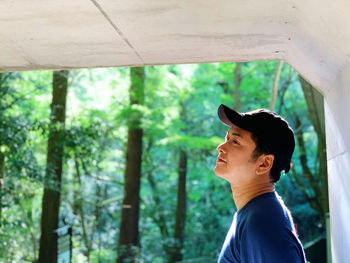 Portrait of young man in forest