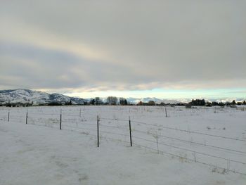 Scenic view of landscape against sky during winter