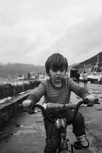 Cute boy riding bicycle