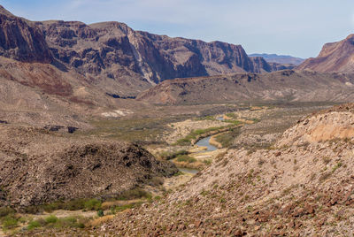 Scenic view of landscape and mountains against sky