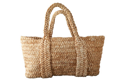 Close-up of wicker basket on white background