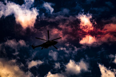 Low angle view of airplane flying in sky