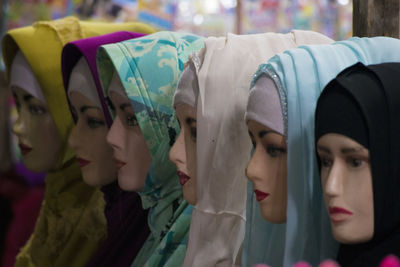 Female mannequins with colorful hijabs in store