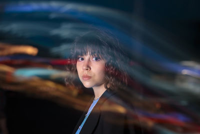 Portrait of young woman looking away