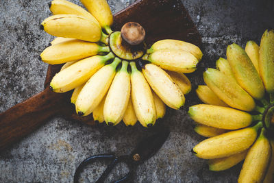 High angle view of yellow fruits on wood