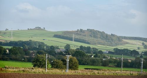 View of fields against mountain range