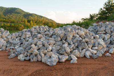View of rocks on land against sky