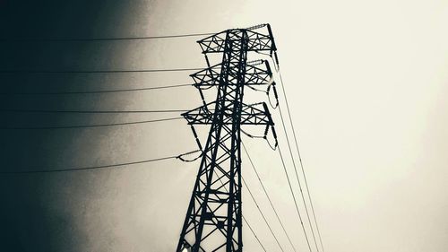 Low angle view of electricity pylon