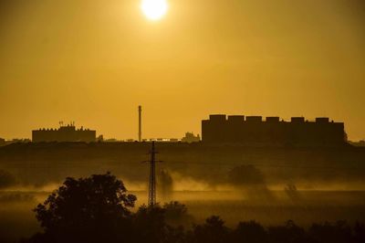 Scenic view of silhouette trees against sky during sunset