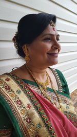 Close-up of woman wearing sari and jewelry