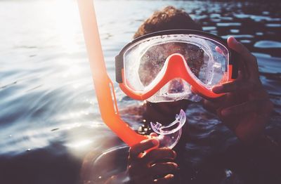 Close-up of man swimming in sea