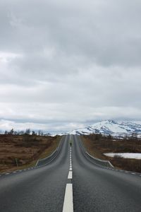 Road amidst landscape against sky