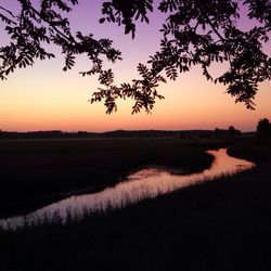 Scenic view of landscape at sunset