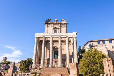 Low angle view of historical building against blue sky