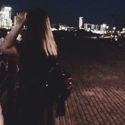 Young woman standing in balcony