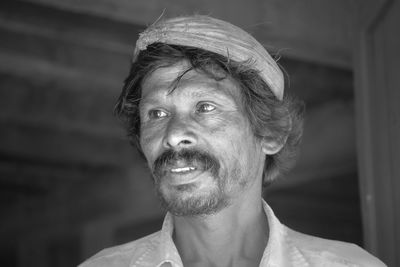 Portrait of man looking away outdoors