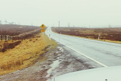 Road passing through field