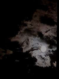 Low angle view of moon in sky at night