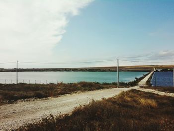 Bridge over sea against sky