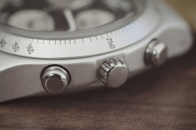 Close-up of clock on table