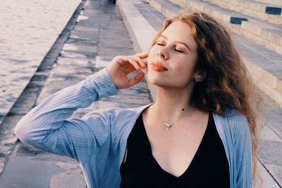 Portrait of young woman eating food