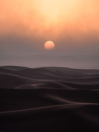 Scenic view of landscape against sky during sunset