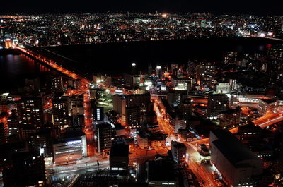 High angle view of illuminated cityscape at night