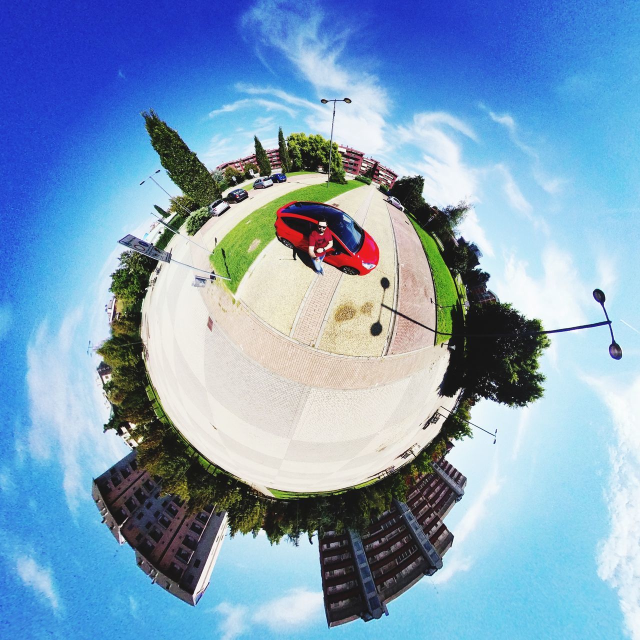 sky, architecture, building exterior, fish-eye lens, cloud - sky, nature, built structure, day, building, reflection, outdoors, plant, low angle view, no people, tree, circle, planet earth, city, sphere, digital composite, distorted image