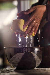 Cropped hand of person washing hands