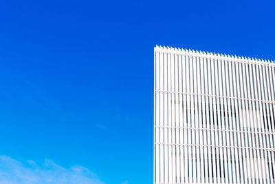 Low angle view of building against clear blue sky