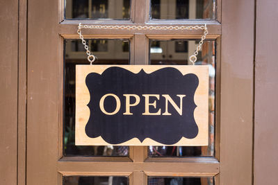 Close-up of heart shape sign on door