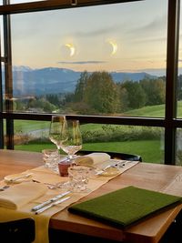 View of glass table at sunset