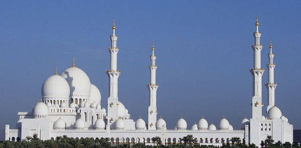 Abu dhabi mosque against clear blue sky