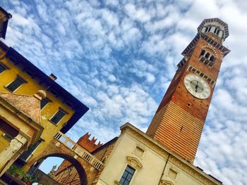 Low angle view of tower against cloudy sky