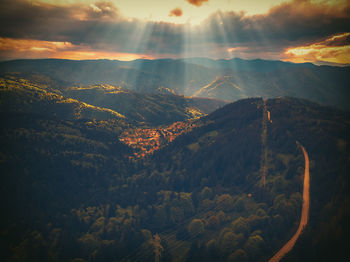 Aerial view of mountains against sky during sunset