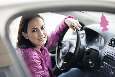 Smiling woman in car