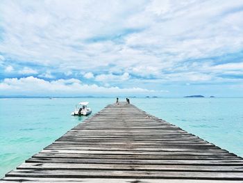 Pier over sea against sky