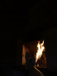 Low angle view of man burning at home
