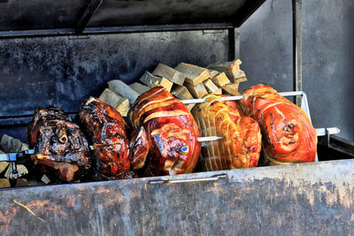 Close-up of rotisserie chicken on barbecue grill