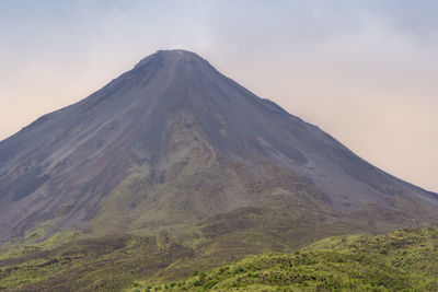 Scenic view of volcanic mountain against sky