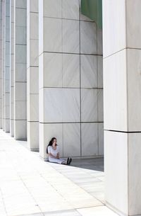 Young woman sitting outdoors